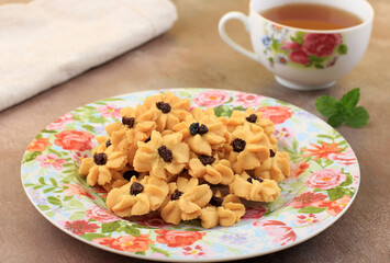 Kue Semprit, Indonesian Traditional Cookies Served to Celebrate Lebaran Idul Fitri Ied Mubarak. Made from Butter, Flour, Egg, with Flower Shape