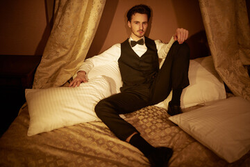 attractive man in night bedroom