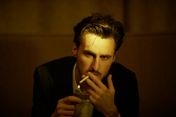 smoking man in dark room