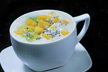 Es teler, Indonesian is a drink that contains pieces of avocado, jackfruit, telasih seeds, sweet milk, coconut milk. Mixed in one glass and given ice cubes. Drinks are very fresh and delicious. 