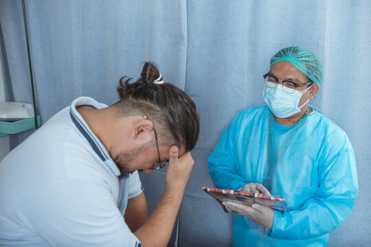 A male patient saddened by the realization of a poor and terminal diagnosis. The bad news sinking in. At the ER ward of a hospital.