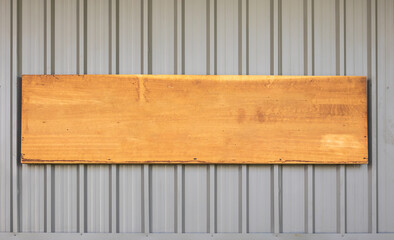 Old wooden sign board on metal texture background