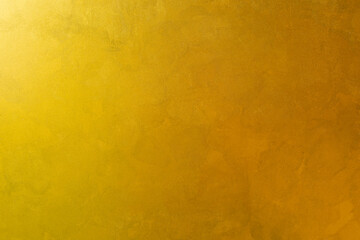 Texture of golden or yellow decorative plaster or concrete. Abstract grunge background for design.