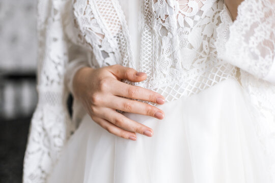 the bride holds the dress in her hands. horizontal photo background to your images
