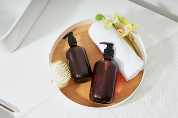 Flat lay composition with different skin care products on the green table in the bathroom ceramic.