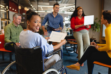 Portrait of smiling african american businesswoman with disability in meeting at office