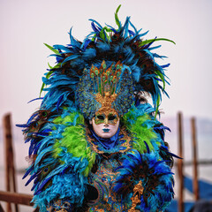 Obraz na płótnie Canvas Traditional masked costumes in Venice, Italy