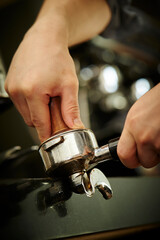 Close-up of barista hands in cafe