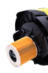 air filter on the cover of a yellow construction vacuum cleaner, isolate on a white background