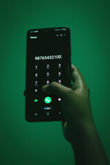 selective focus of mobile phone holding by hand.