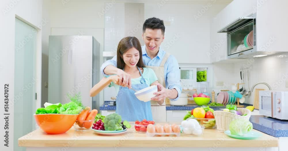 Sticker young couple are cooking together