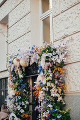 Fototapeta na wymiar cute artificial flower decoration with eggs on the building, colorful and beautiful