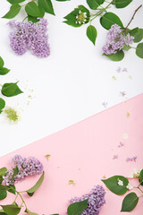 White and pink background with lilac flowers. © bit24