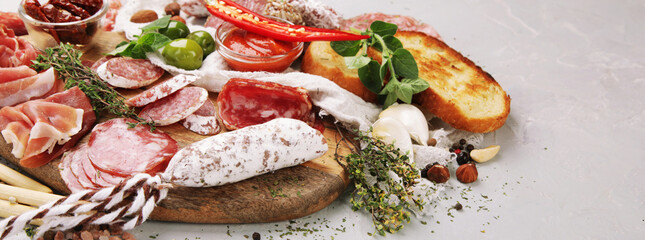 Sausages assortment on light background.