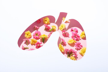 Concept of allergy, pink and yellow flowers and lungs