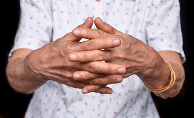 Hands of Asian elder woman. Concept of rheumatoid arthritis, osteoarthritis, or joint pain