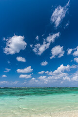 Fototapeta na wymiar Dramatic sky in sunny day at a paradise beach, crystal clear turquoise water.
