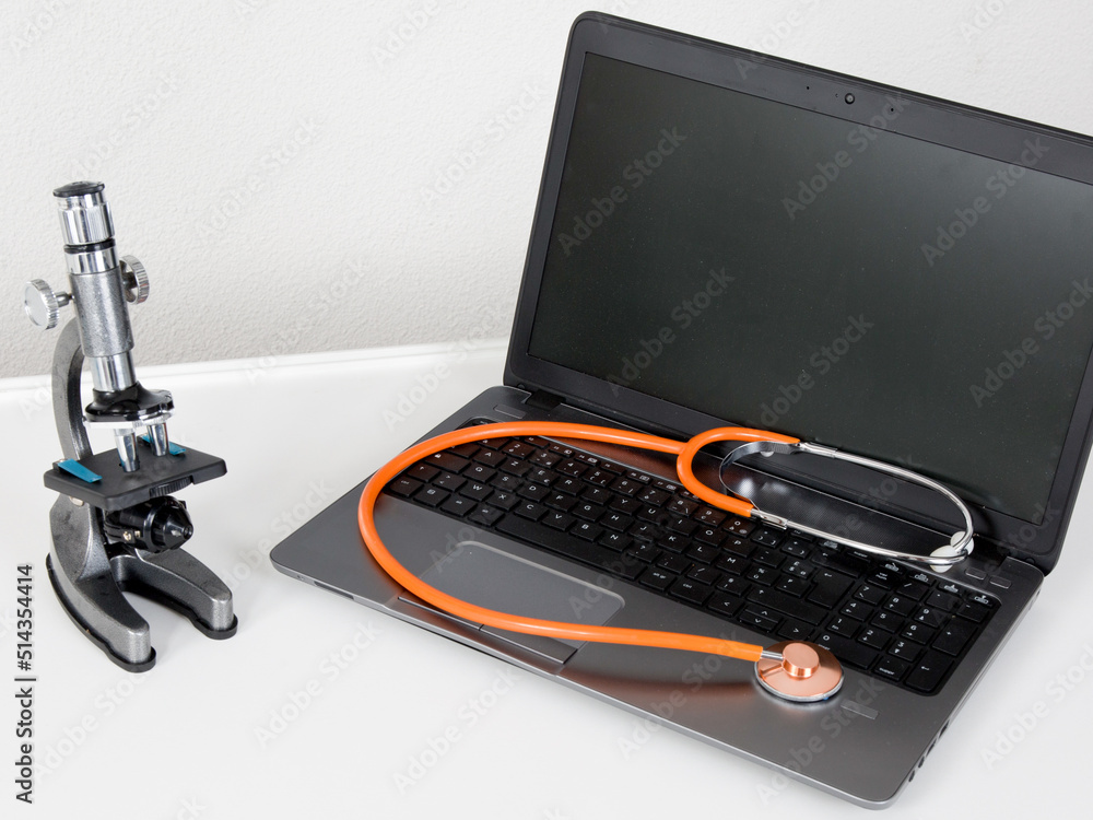 Wall mural stethoscope doctor on laptop in medecine concept