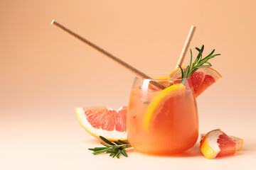 Summer cocktail with grapefruit, rosemary, and ice.