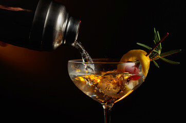 Cocktail with cherry, rosemary, and lemon.