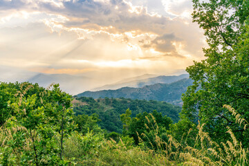 Mountain valley during sunset or sunrise. Natural spring or summer season landscape