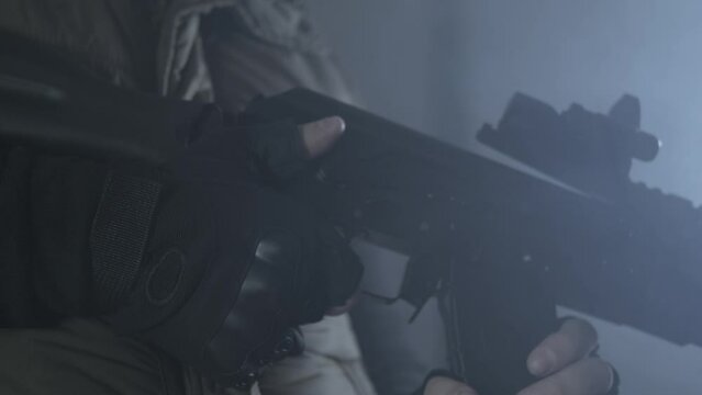 Reloading weapons. Black background. Saiga TG2.