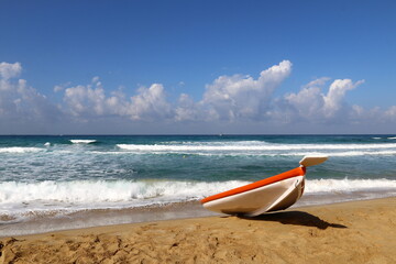 The boat stands on the beach on the Mediterranean Sea