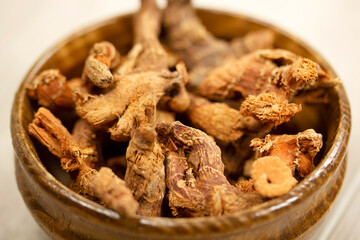 turmeric roots on bamboo plate