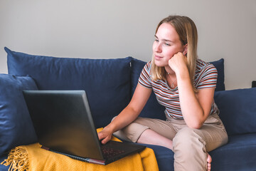 Fototapeta premium Remote work.Girl freelancer works remotely on the seashore.workation, remote work,WFVH,Van Life vibes work from vacation home,work travel,remotely work.Travelling