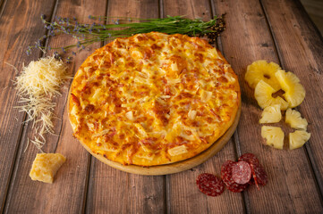 Italian pizza with pineapple, ham and cheese