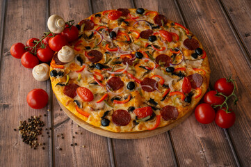 Italian pizza with mushrooms, tomatoes
