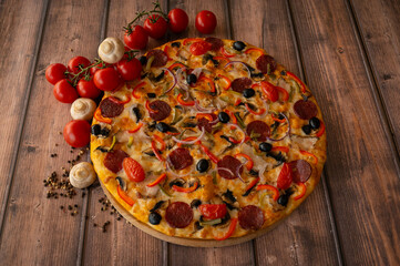 Italian pizza with mushrooms, tomatoes, pepper