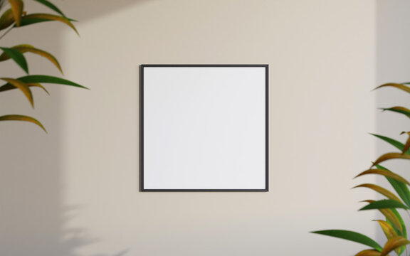 Clean and minimalist front view square black photo or poster frame mockup hanging on the wall with blurry plant. 3d rendering.