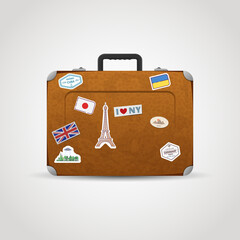 Vintage travel suitcase with stickers, badges and images. Old leather bag for holidays and voyage. Tourism luggage vector illustration. Retro case for vacation.