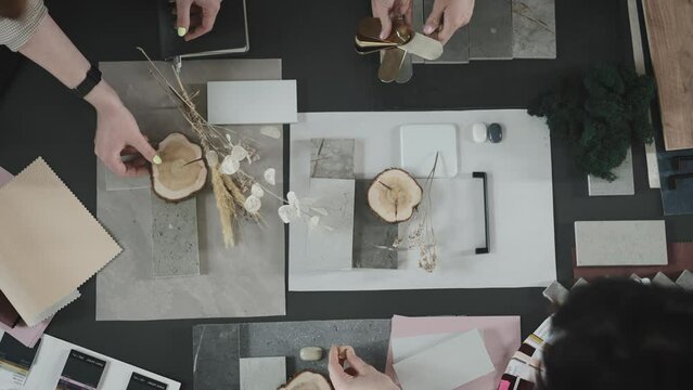 Creative studio solutions for interior design. Designers, men and women, choose combinations of surfaces and textures.