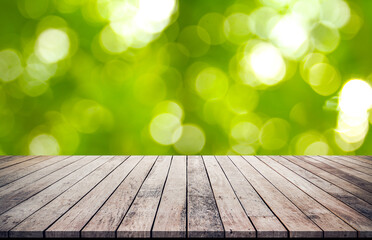 Naklejka na ściany i meble Old wood plank with abstract natural green blurred bokeh background for product display 