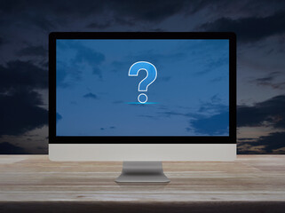 Question mark sign icon on modern computer screen on wooden table over sunset sky, Business...