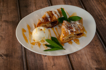 Pancakes on plate with cup of condensed milk