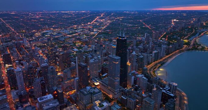 Amazing Chicago Skyline Filled With Lights At Night Time. Stunning Metropolis Downtown At The Lake Waterfront. Top View.