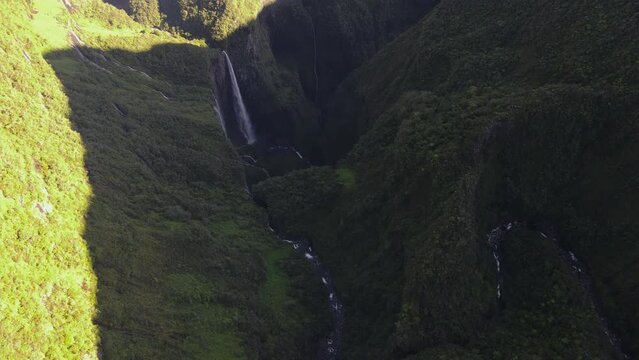 Drone footage of the Trou de Fer waterfalls at the Reunion island between cliffs and jungle.