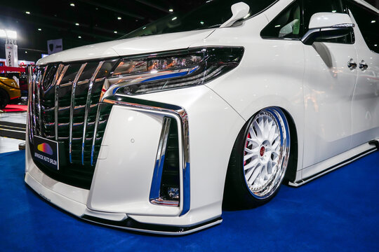 Bangkok, Thailand - 1 july 2022: Alphard, white, Super Lowest Car with beautiful wheels at the Bangkok auto salon 2022.                         