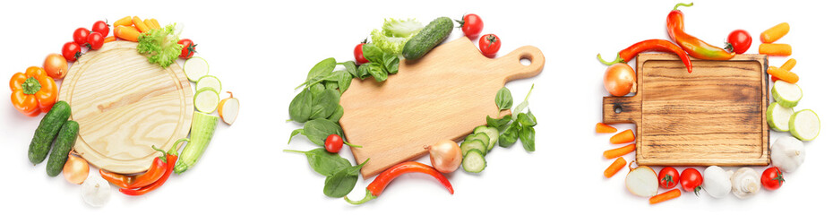 Set of empty wooden cutting boards with fresh vegetables on white background, top view