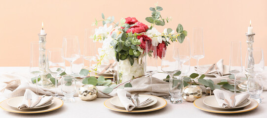 Beautiful festive table setting with floral decor and candles
