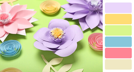 Beautiful handmade paper flowers on green background. Different color patterns