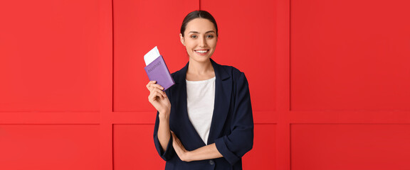 Young woman  with documents on red background