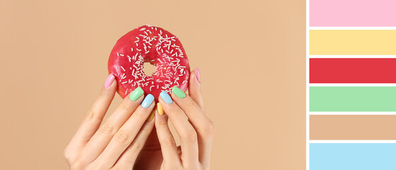 Female hands with beautiful manicure and donut on beige background. Different color patterns