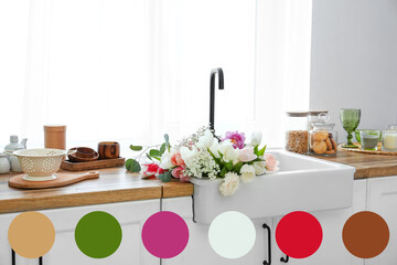 Sink with beautiful flowers near window in kitchen. Different color patterns