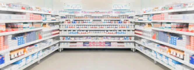 Foto op Plexiglas Pharmacy drugstore shelves interior blur medical background © Piman Khrutmuang