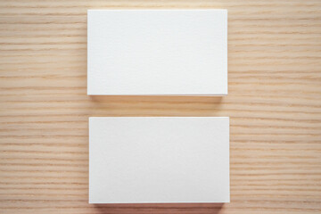 White business card on wood table background