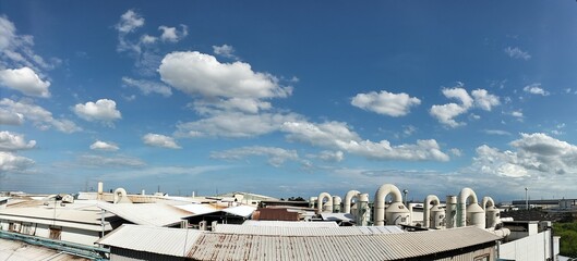 Exterior of modern Factory plant with reactor and converters under sky with copyspace